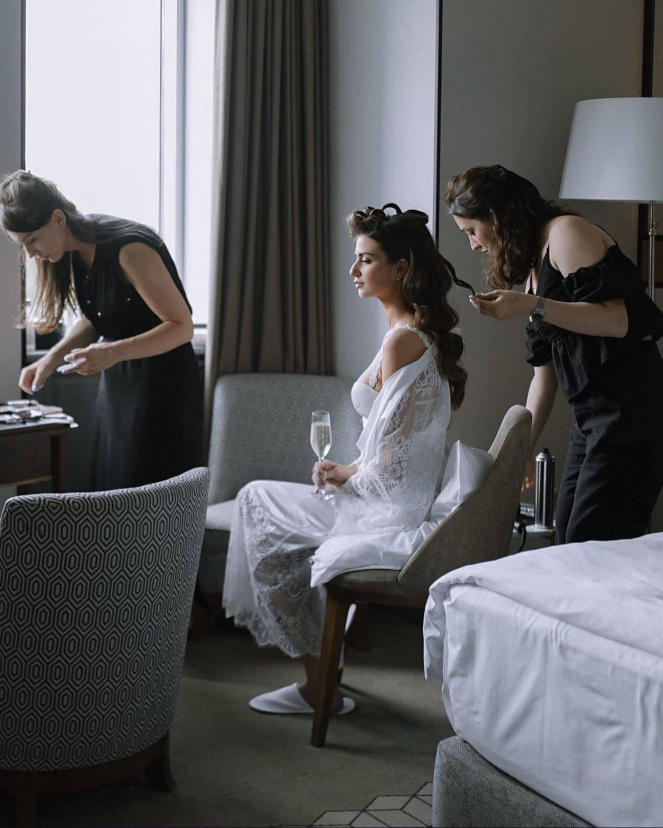 Bride getting ready by window
